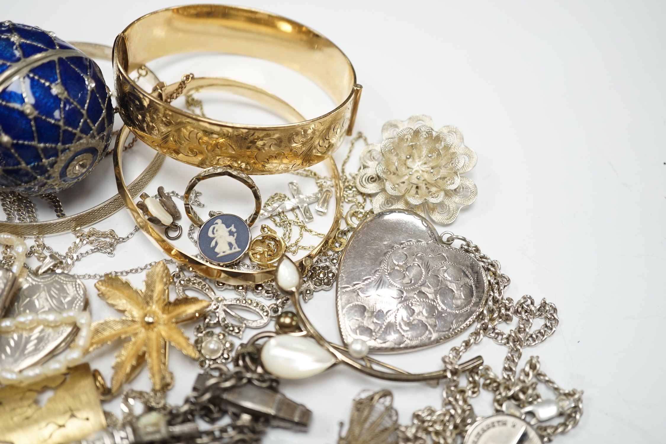 A quantity of assorted costume and silver jewellery including pendants, locket, bracelets, bangles, chains etc.